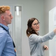 female-engineer-holding-presentation-3862615