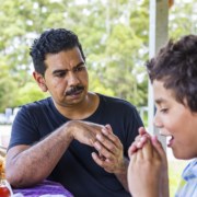 Australian Aboriginal Man and Boy Talking