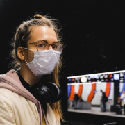 Girl at train station in mask